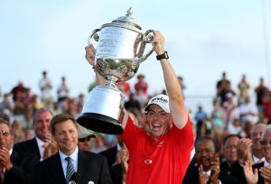 Rory McIlroy proudly holds the Rodman Wanamaker Trophy after winning the PGA Championship – Credit: Getty
