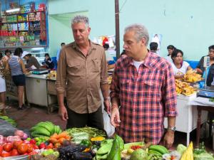 Anthony Bourdain (left) with chef and author Eric Ripert (right)  at market in Lima, Peru